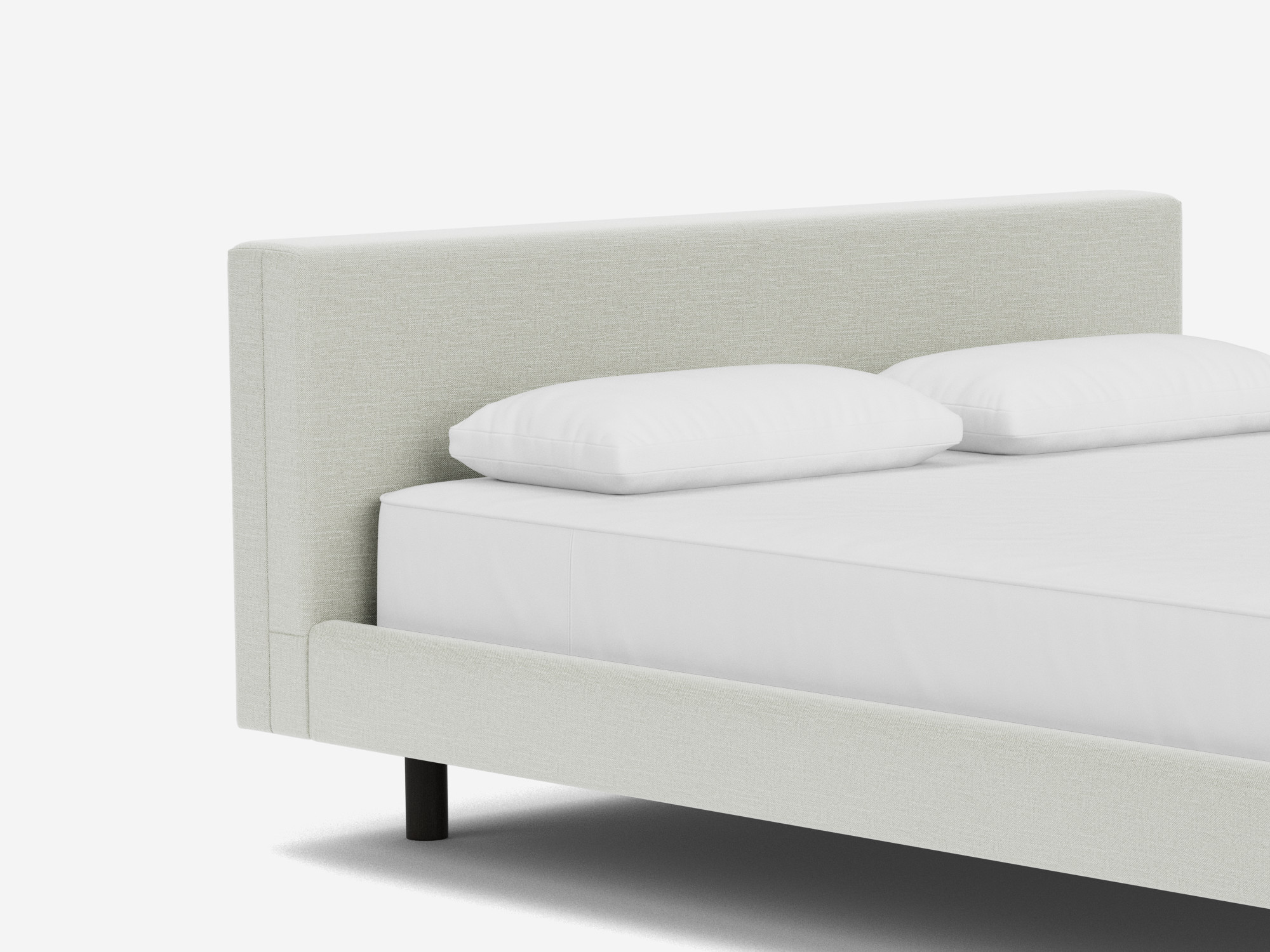 Light grey upholstered frame bed detail view